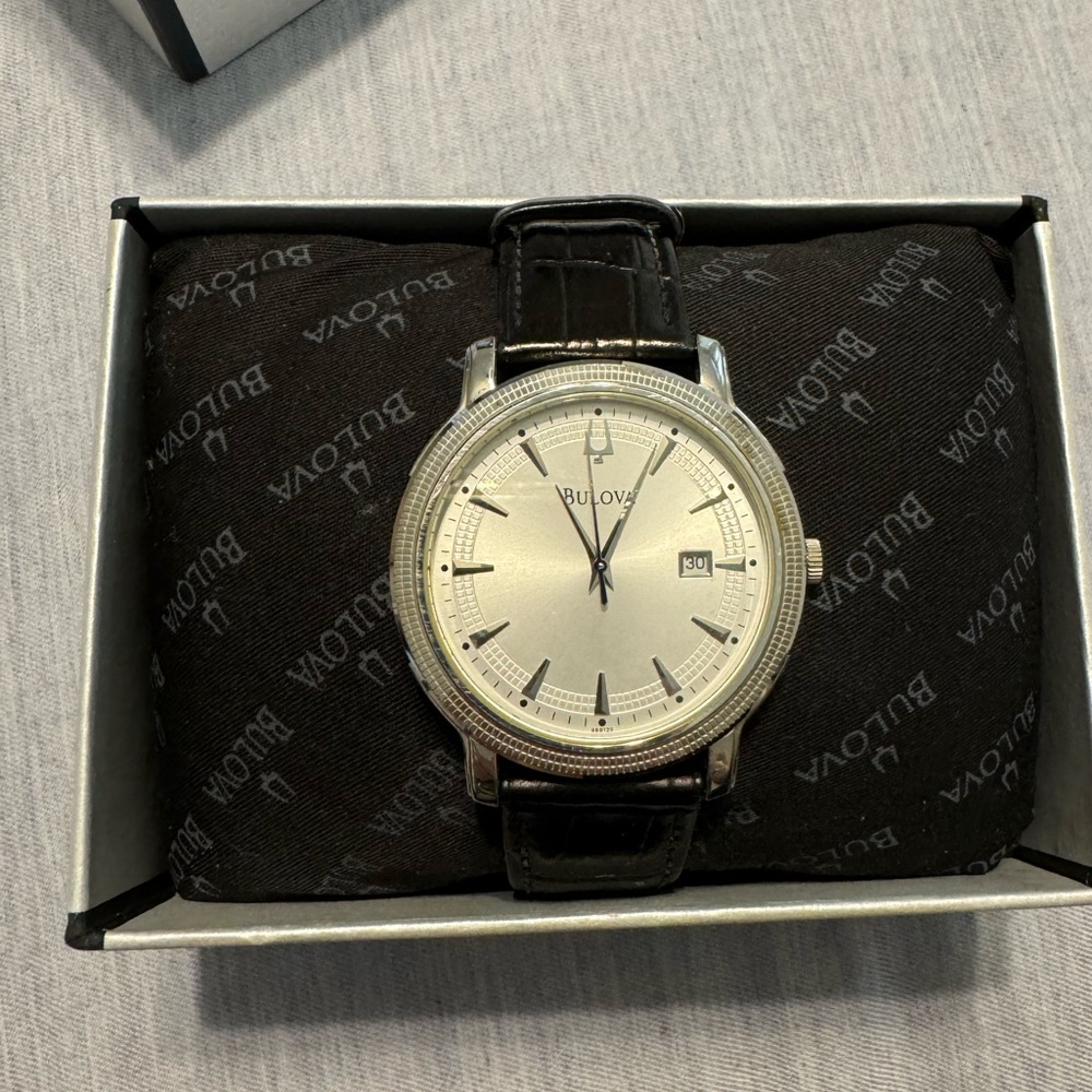 Men’s Bulova watch with black leather band